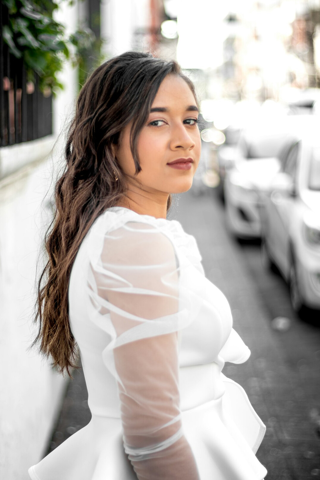 Professional portrait of a woman editor with dark wavy hair