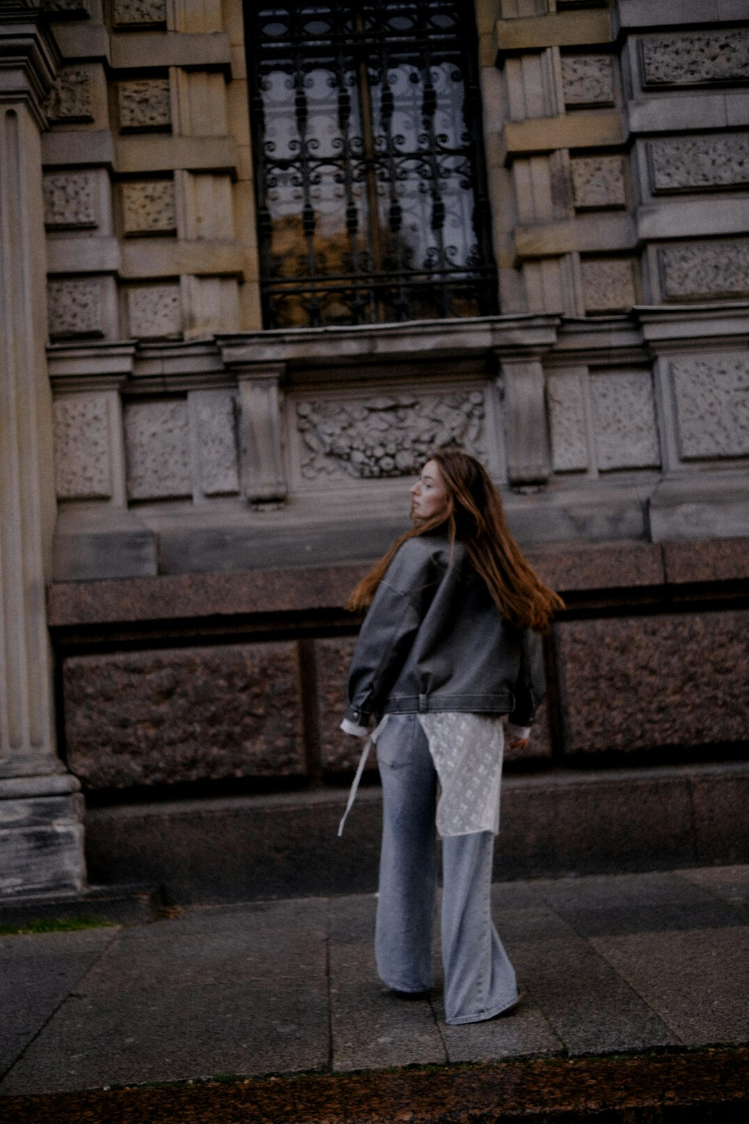young woman walking city street